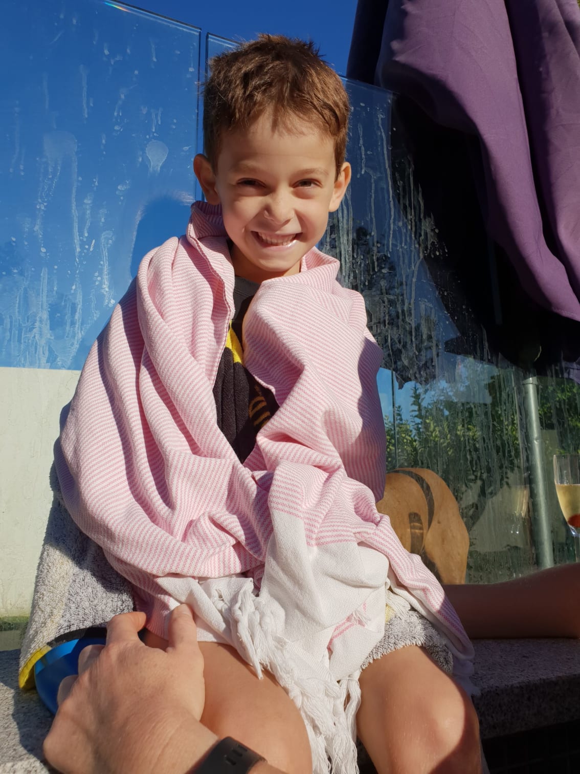 Max in pink towel after swimming