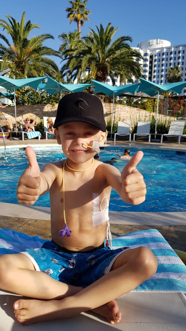 Max at the pool giving the thumbs up