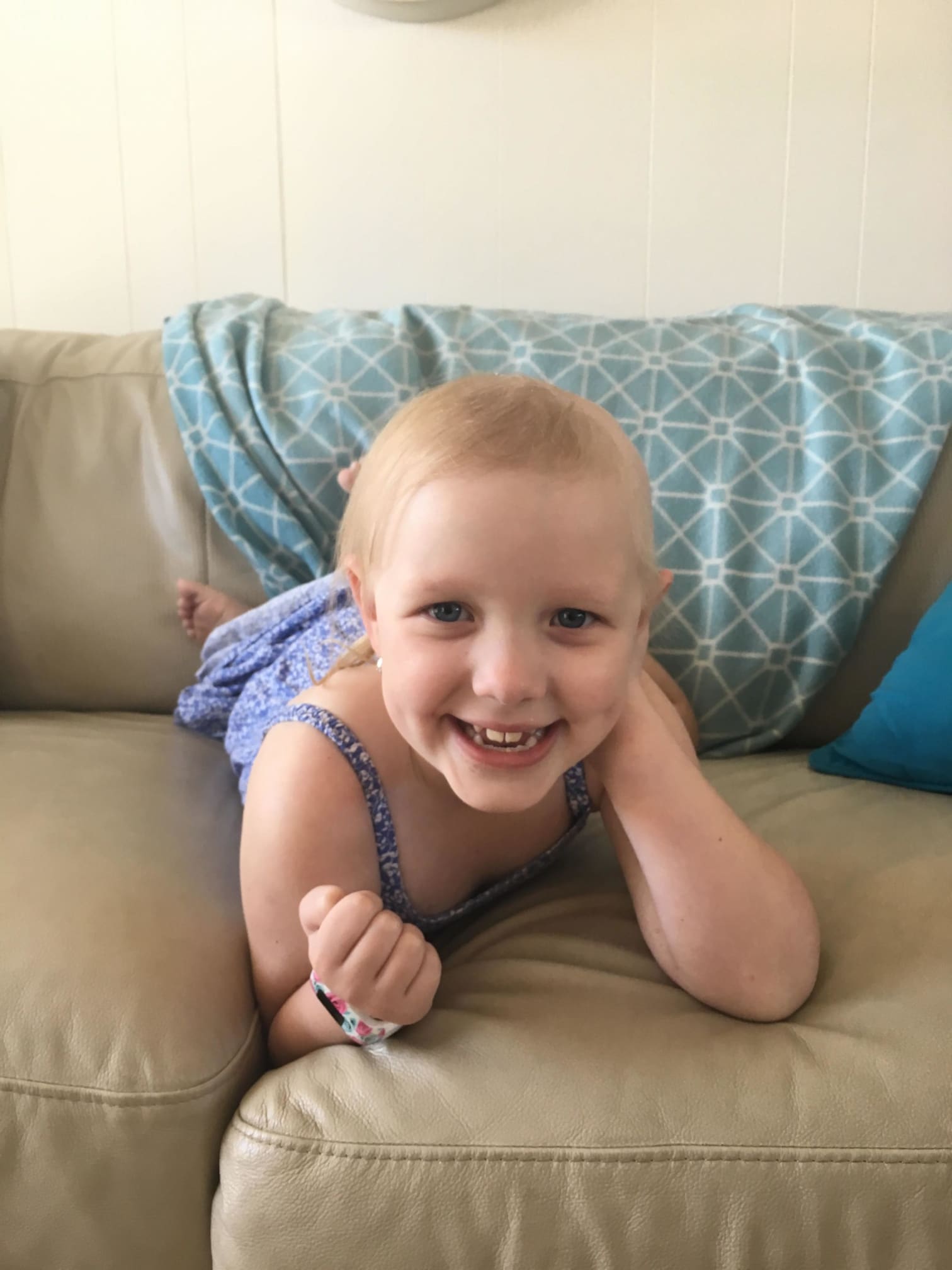 Evie smiling with bracelet